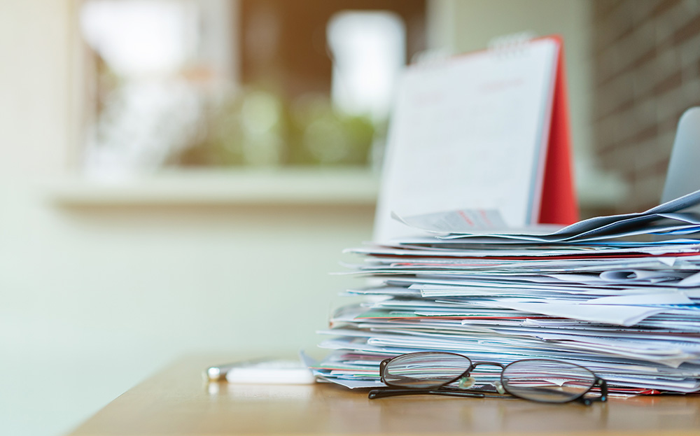 Pile of letters and bills on a table